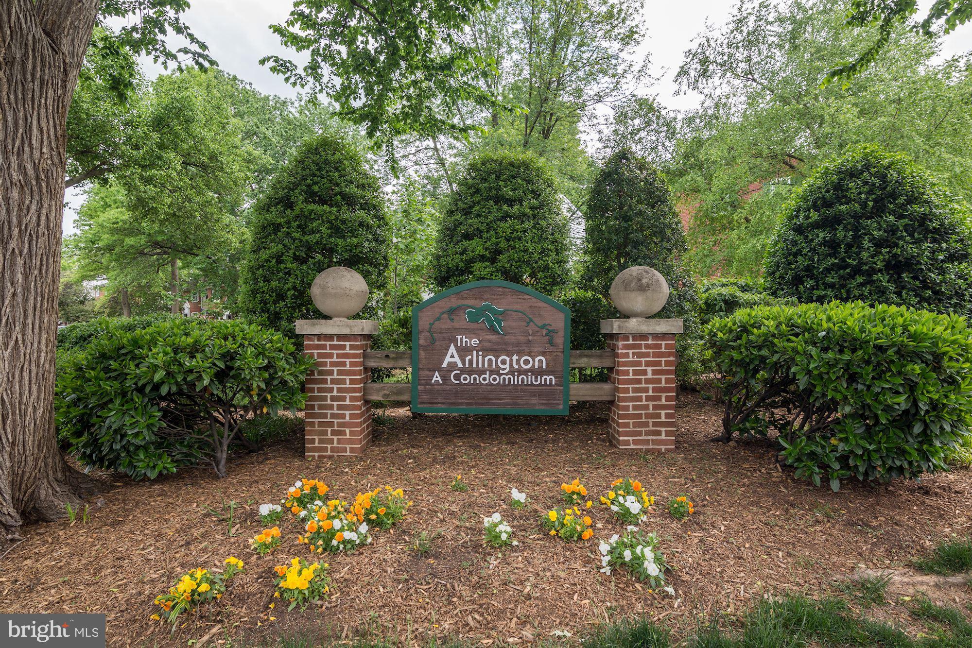 4626 B 28th Road South, Unit B Arlington, VA 22206 - Photo 2 of 22 a front view of a house with a yard and garden