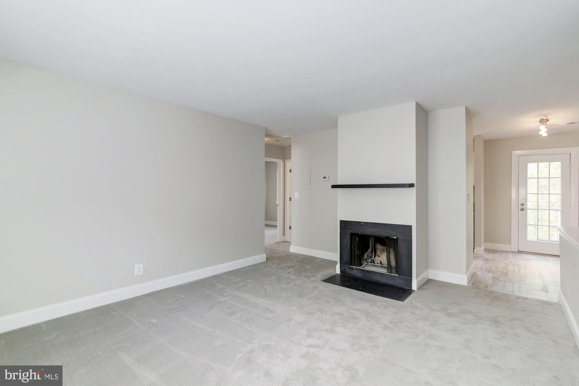 4626 B 28th Road South, Unit B Arlington, VA 22206 - Photo 5 of 22 a living room with furniture and a fireplace
