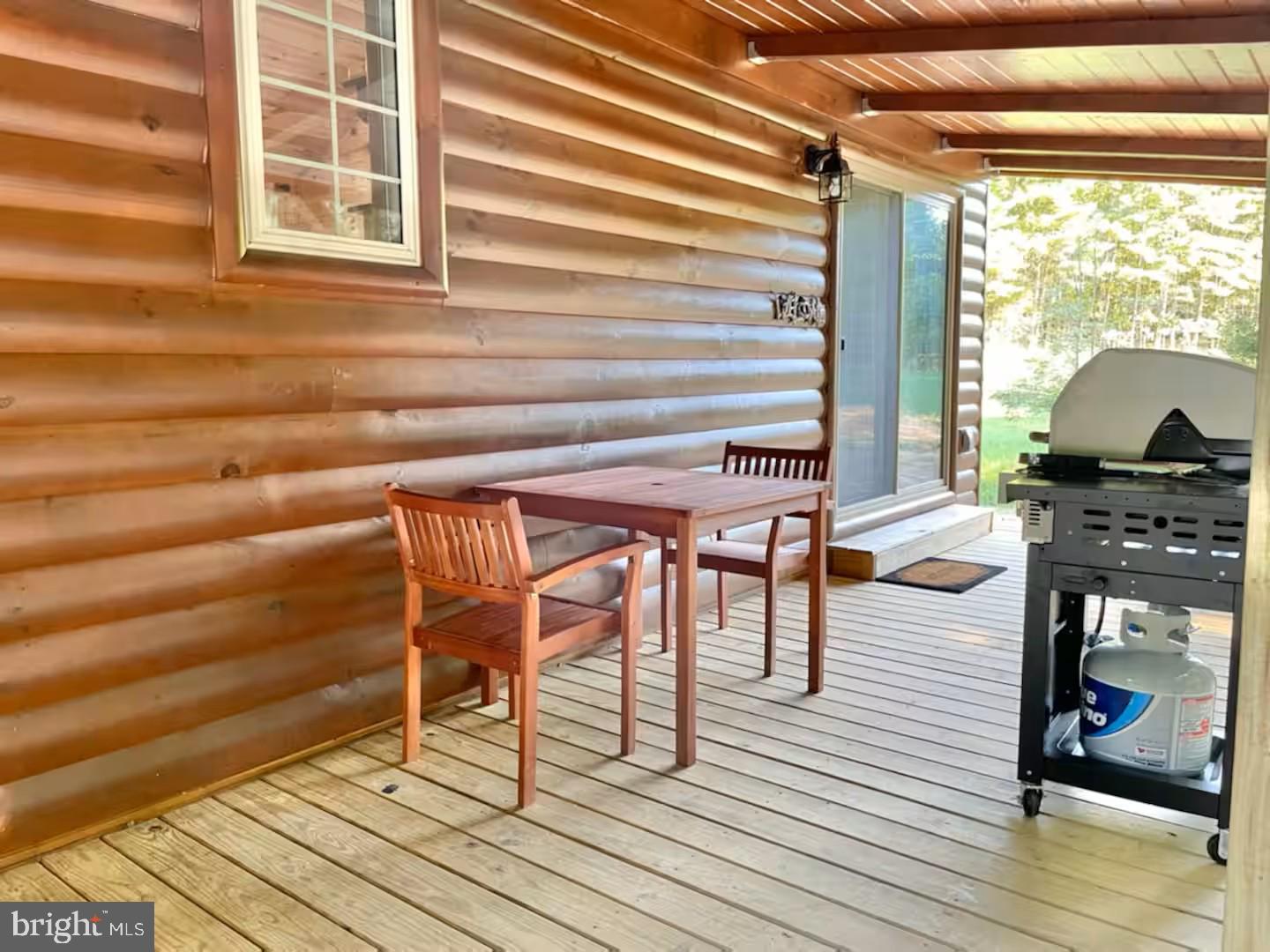 184 Skiles- Pitsenbarger Road Franklin, WV 26807 - Photo 10 of 39 Cozy outdoor dining space awaits you.