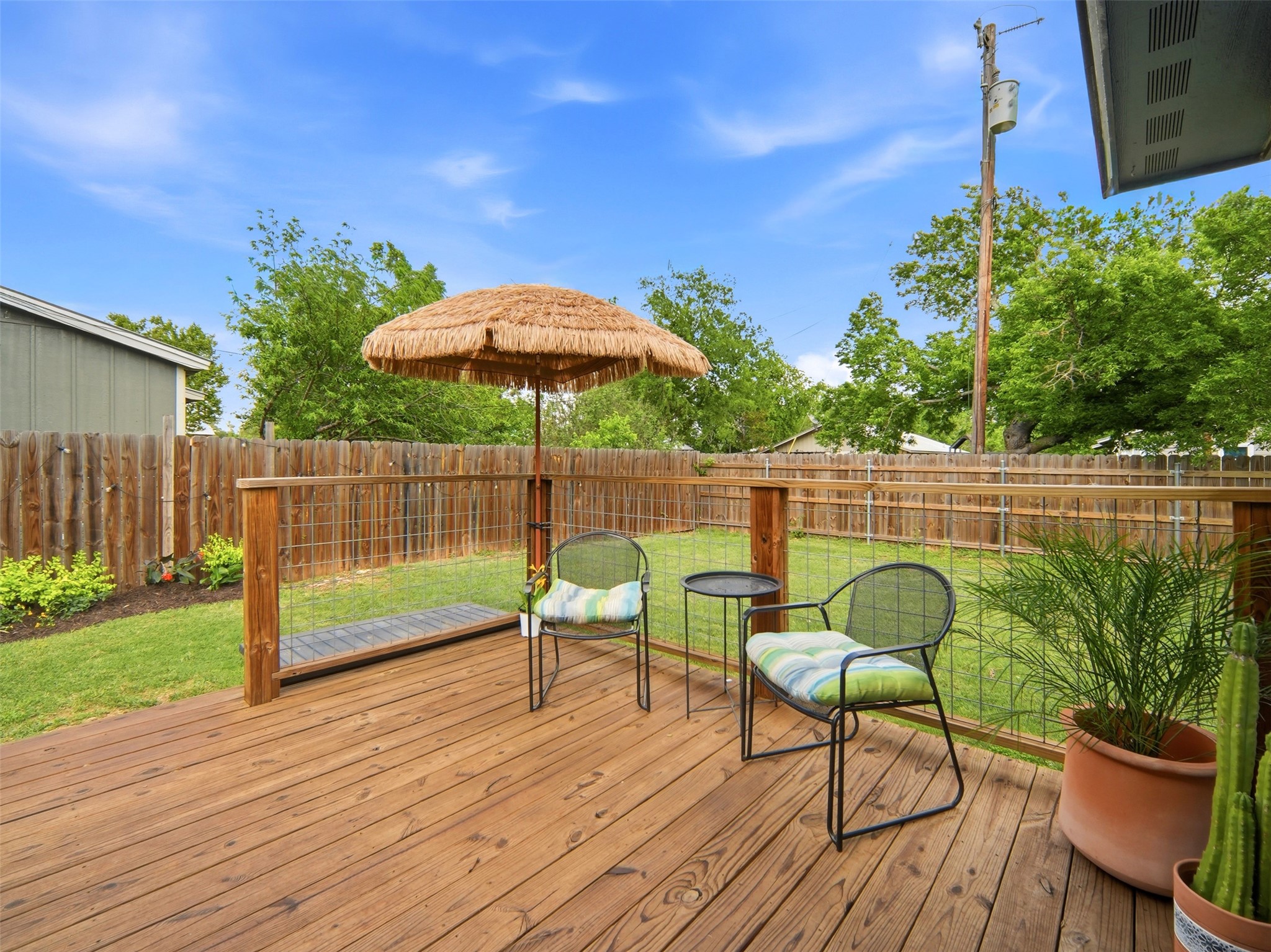 700 9th Street Blanco, TX 78606 - Photo 23 of 33 a view of a deck with furniture and a garden