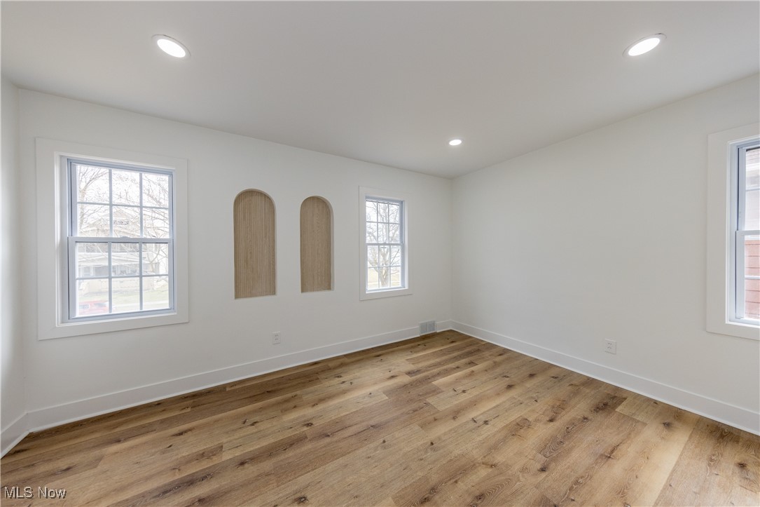 3694 Chelton Road Cleveland, OH 44120 - Photo 17 of 33 Spare room featuring baseboards, light wood-style flooring, and recessed lighting