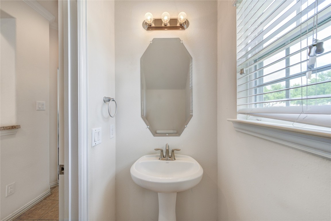 5103 Dartmoor Ridge Trail Houston, TX 77066 - Photo 16 of 47 a bathroom with a sink and a mirror