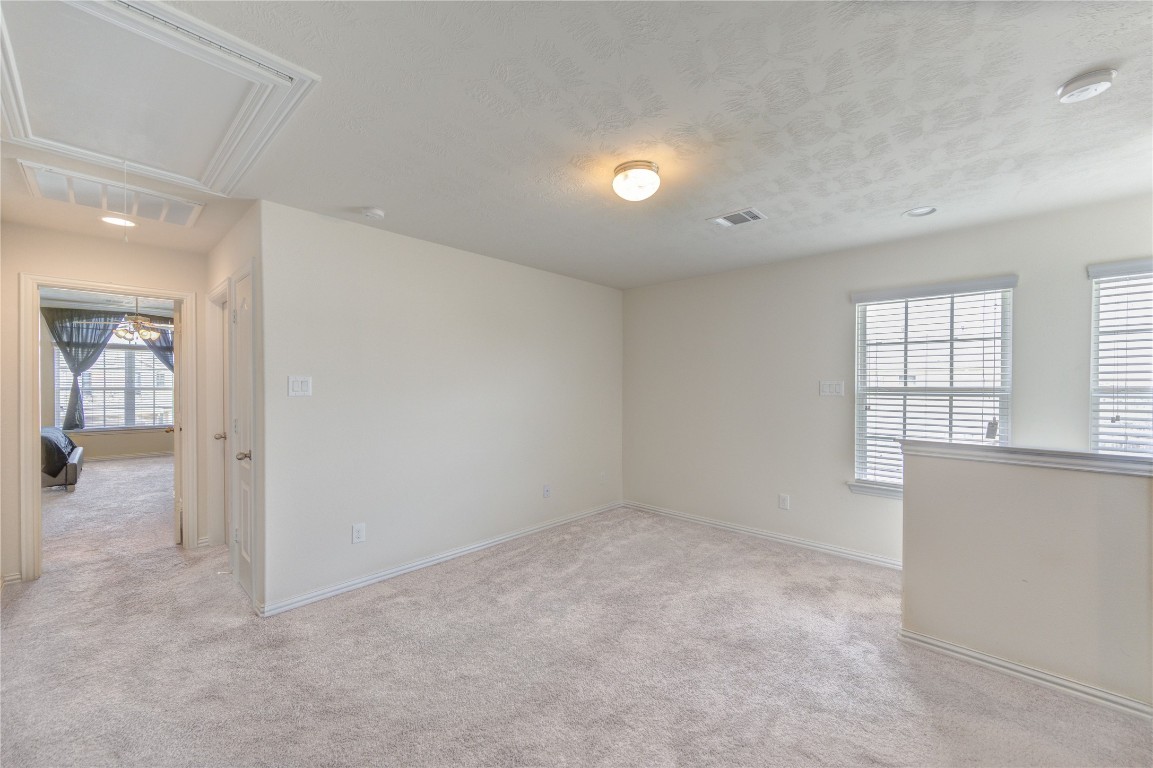 5103 Dartmoor Ridge Trail Houston, TX 77066 - Photo 19 of 47 wooden floor in an empty room and a window
