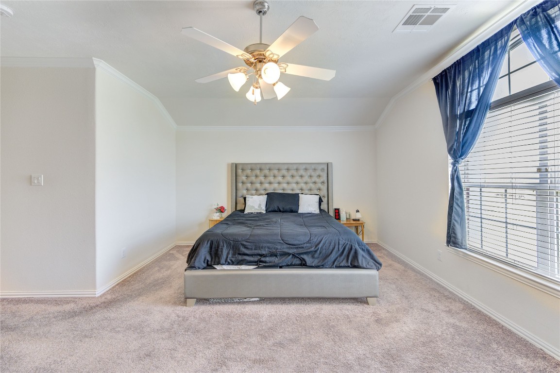 5103 Dartmoor Ridge Trail Houston, TX 77066 - Photo 23 of 47 a living room with a couch and a chandelier