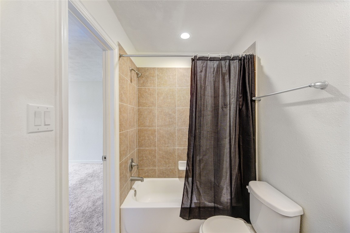 5103 Dartmoor Ridge Trail Houston, TX 77066 - Photo 30 of 47 a bathroom with a toilet and a shower