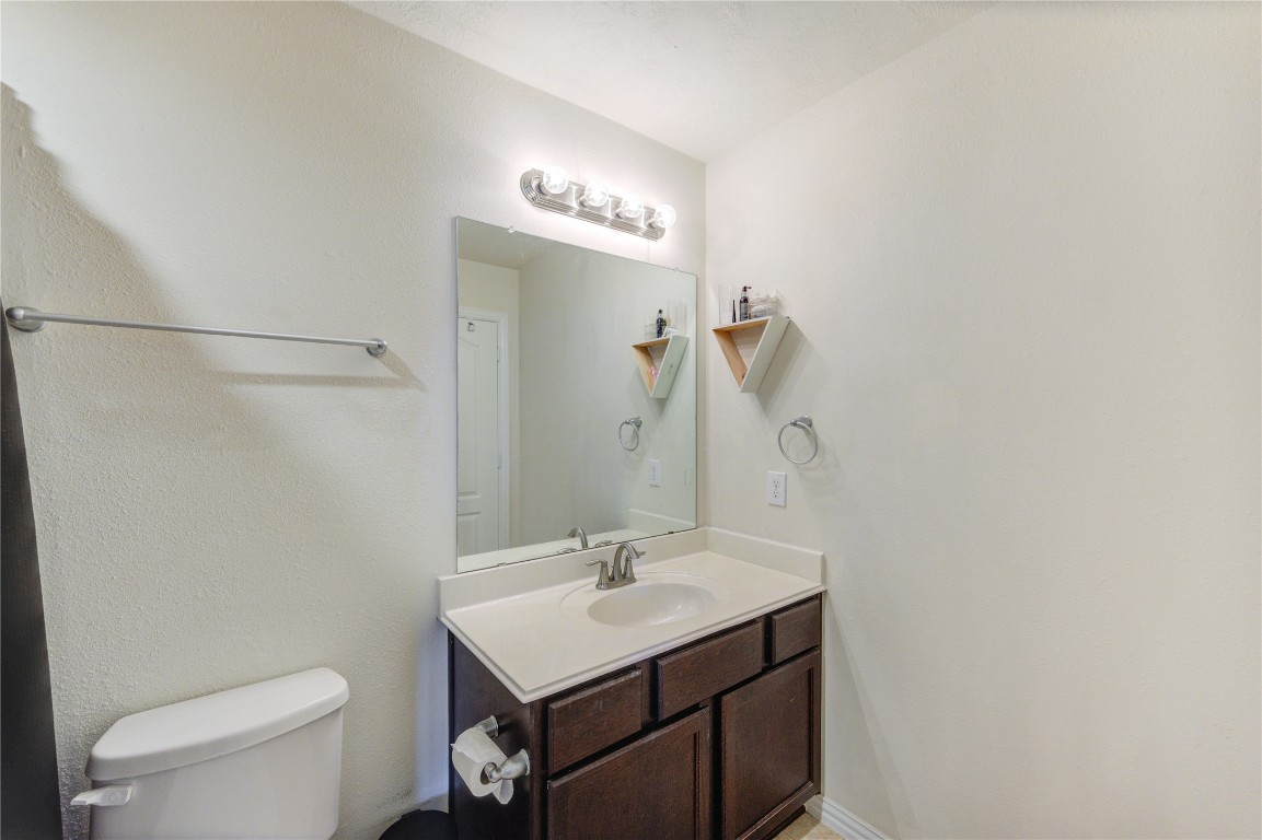 5103 Dartmoor Ridge Trail Houston, TX 77066 - Photo 32 of 47 a bathroom with a sink a toilet and a mirror