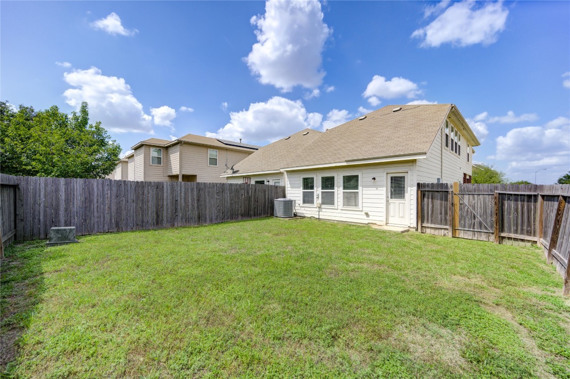5103 Dartmoor Ridge Trail Houston, TX 77066 - Photo 37 of 47 a view of a yard in front of a house with wooden fence