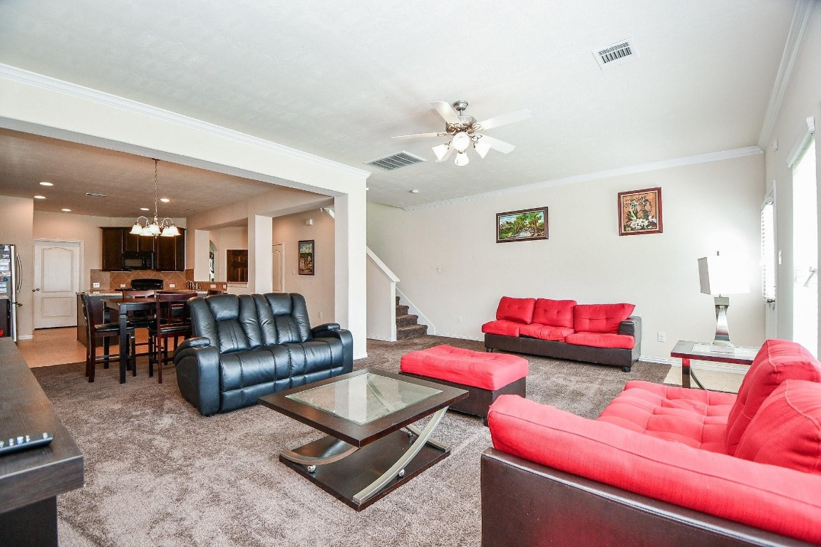 5103 Dartmoor Ridge Trail Houston, TX 77066 - Photo 9 of 47 a living room with furniture kitchen view and a table