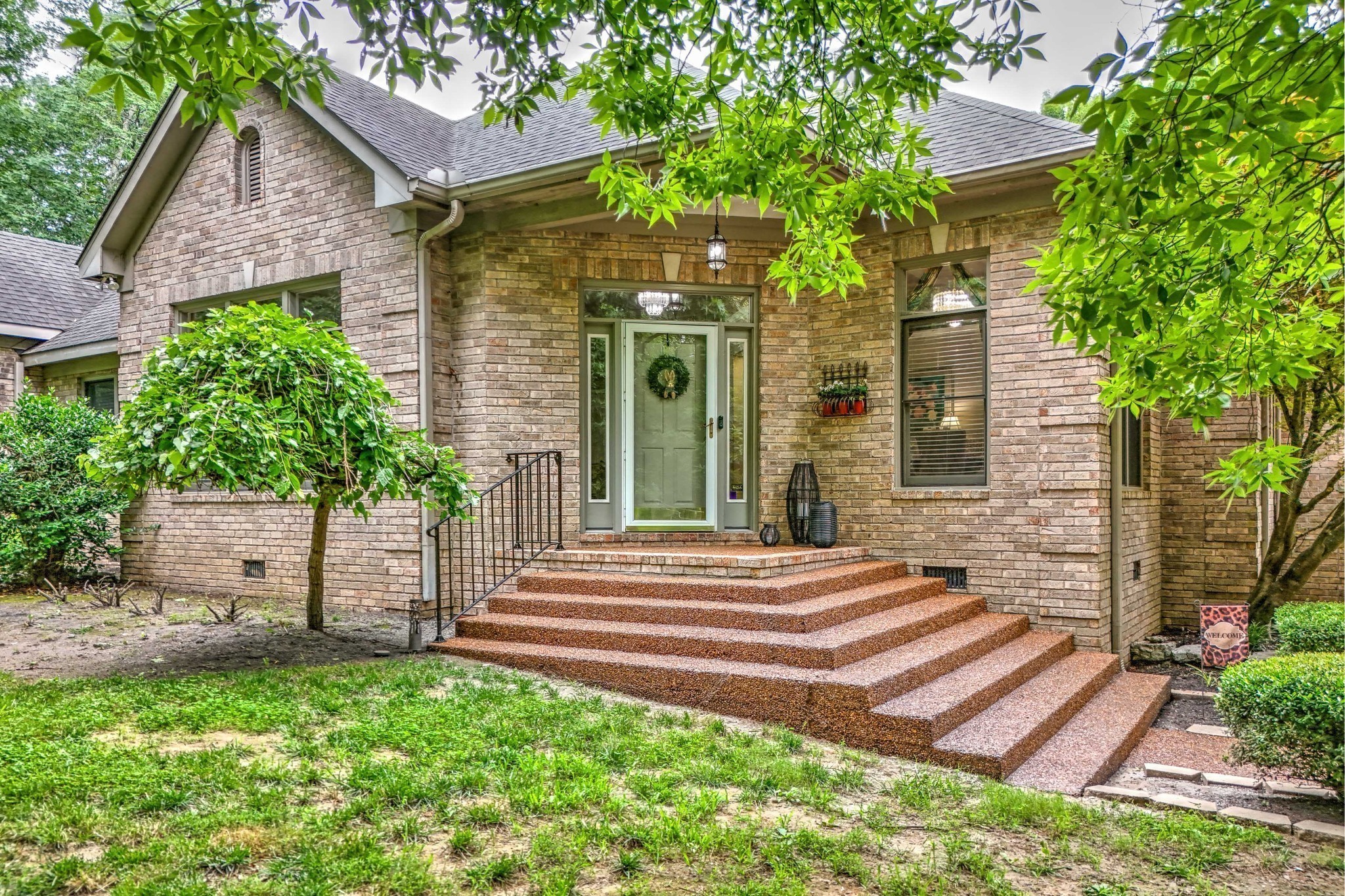 5544 South New Hope Road Hermitage, TN 37076 - Photo 1 of 62 a front view of a house with a garden