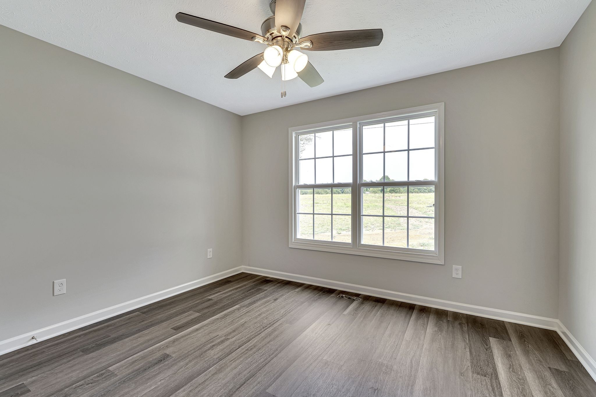5419 Old Manchester Highway Tullahoma, TN 37388 - Photo 14 of 24 wooden floor in an empty room with a window