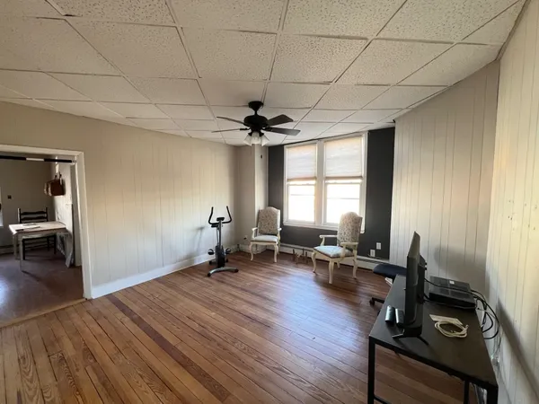 a view of a room with gym equipment and a window