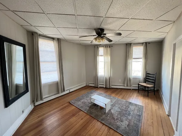 a view of entryway with wooden floor