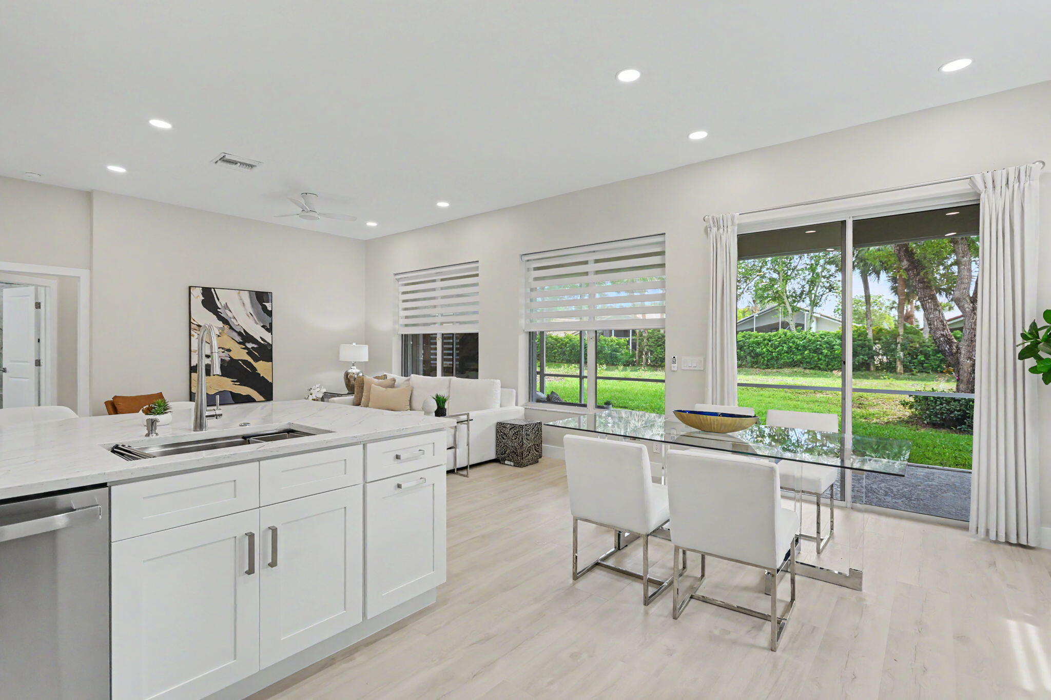 7832 Rockford Road Boynton Beach, FL 33472 - Photo 14 of 40 a kitchen with a sink and wooden floor
