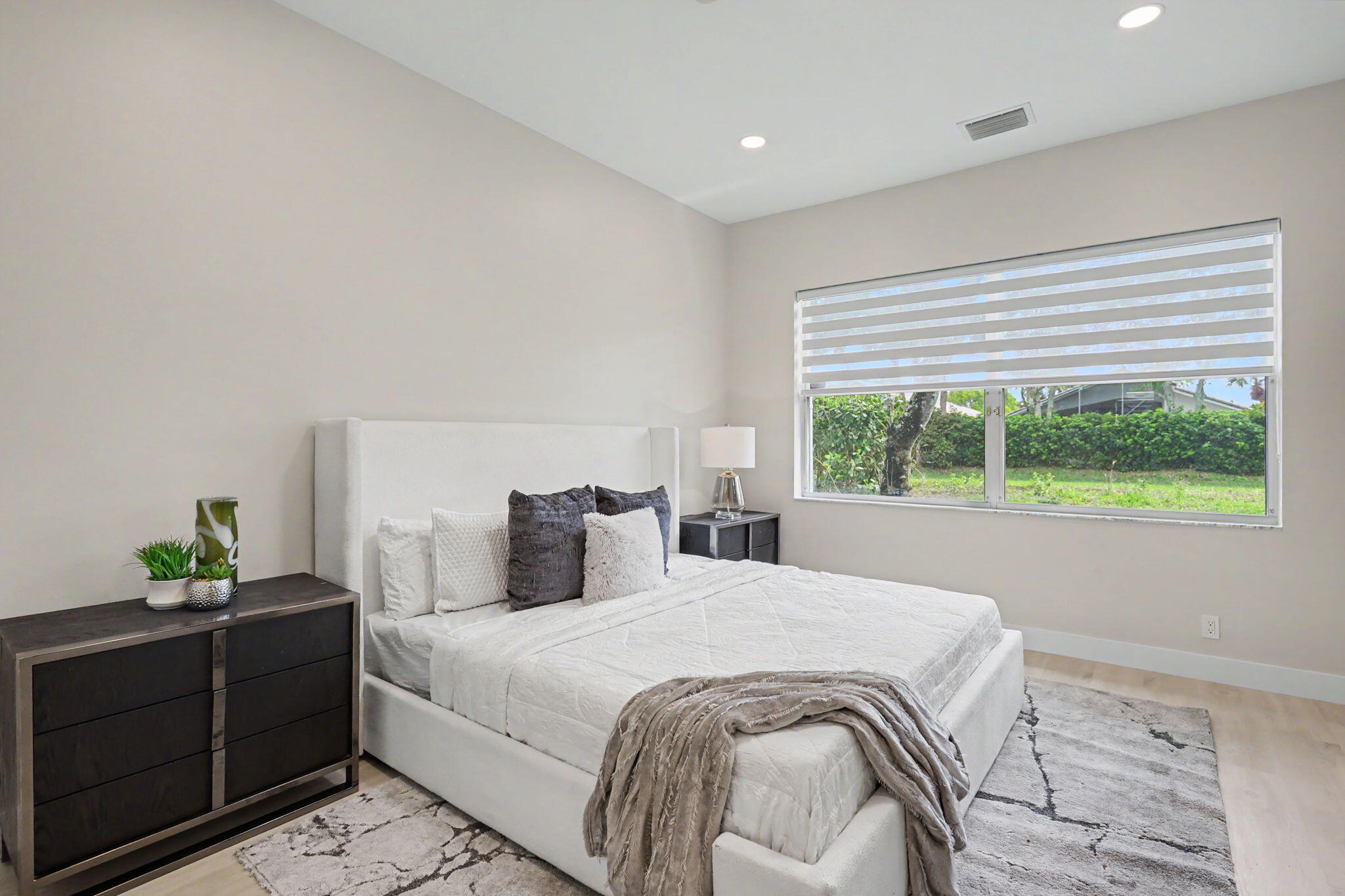 7832 Rockford Road Boynton Beach, FL 33472 - Photo 16 of 40 a bedroom with a bed and a window