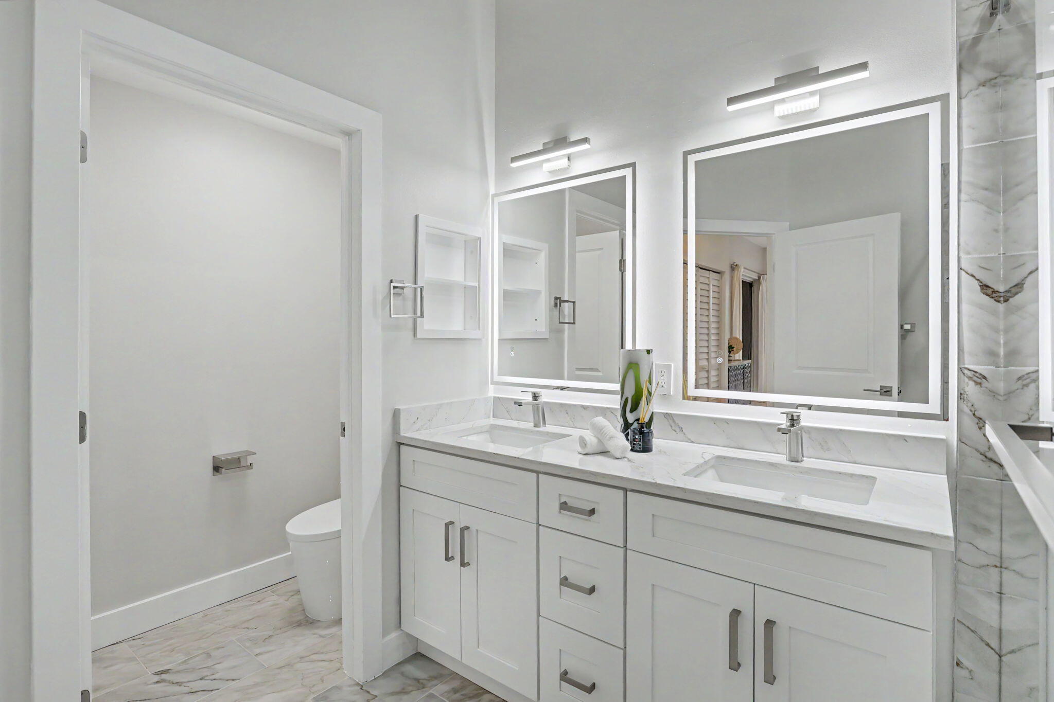 7832 Rockford Road Boynton Beach, FL 33472 - Photo 20 of 40 a bathroom with a granite countertop sink a toilet and a mirror