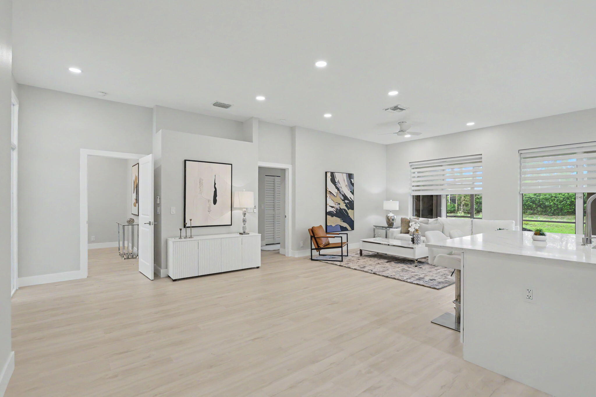 7832 Rockford Road Boynton Beach, FL 33472 - Photo 23 of 40 a living room with furniture and a large window