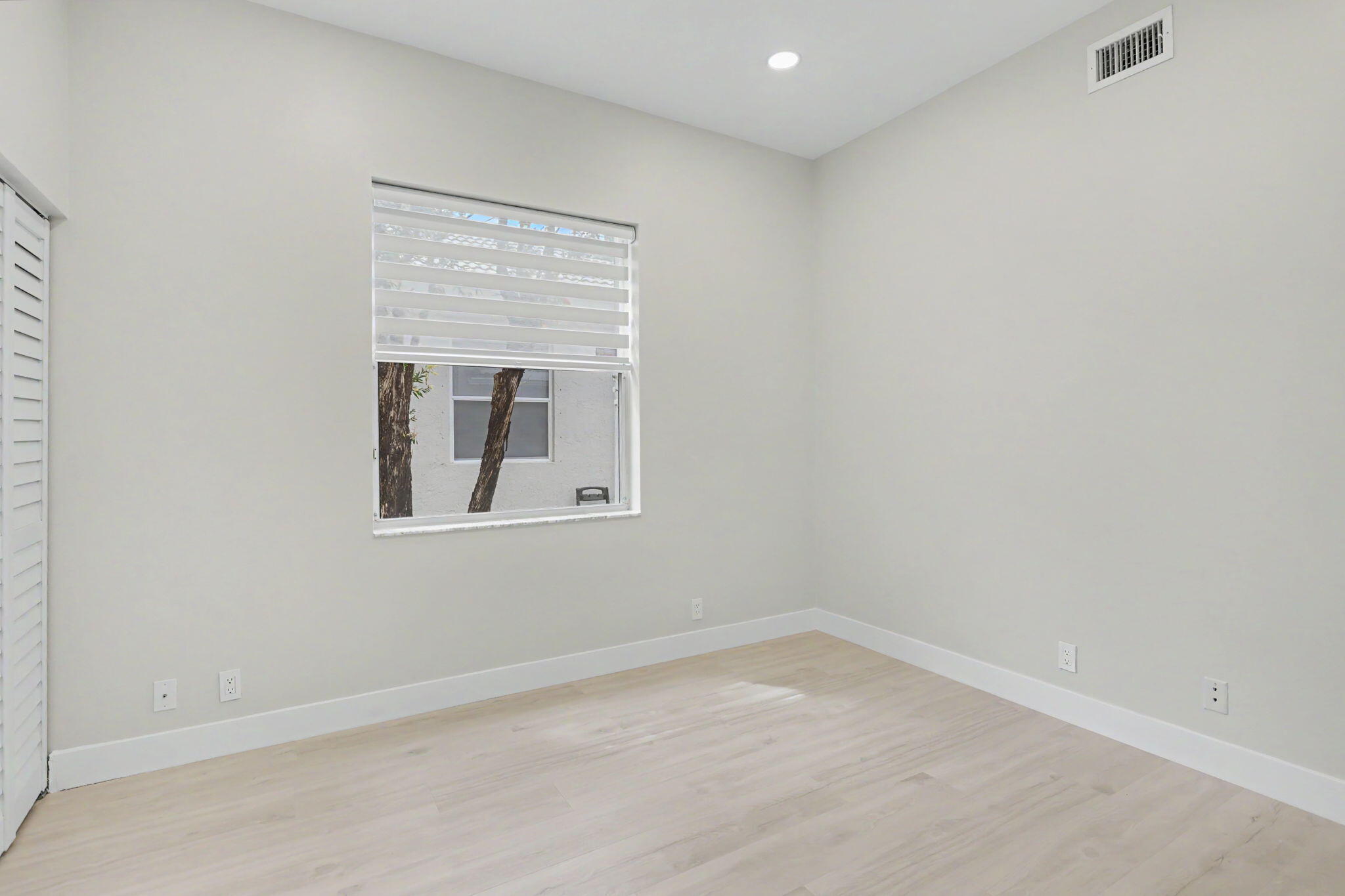 7832 Rockford Road Boynton Beach, FL 33472 - Photo 24 of 40 an empty room with a window