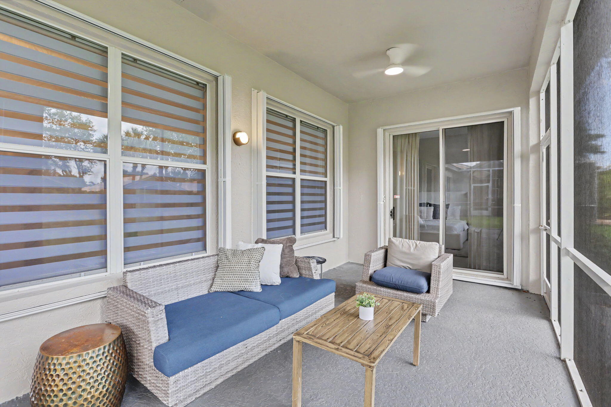 7832 Rockford Road Boynton Beach, FL 33472 - Photo 30 of 40 a living room with furniture and a window