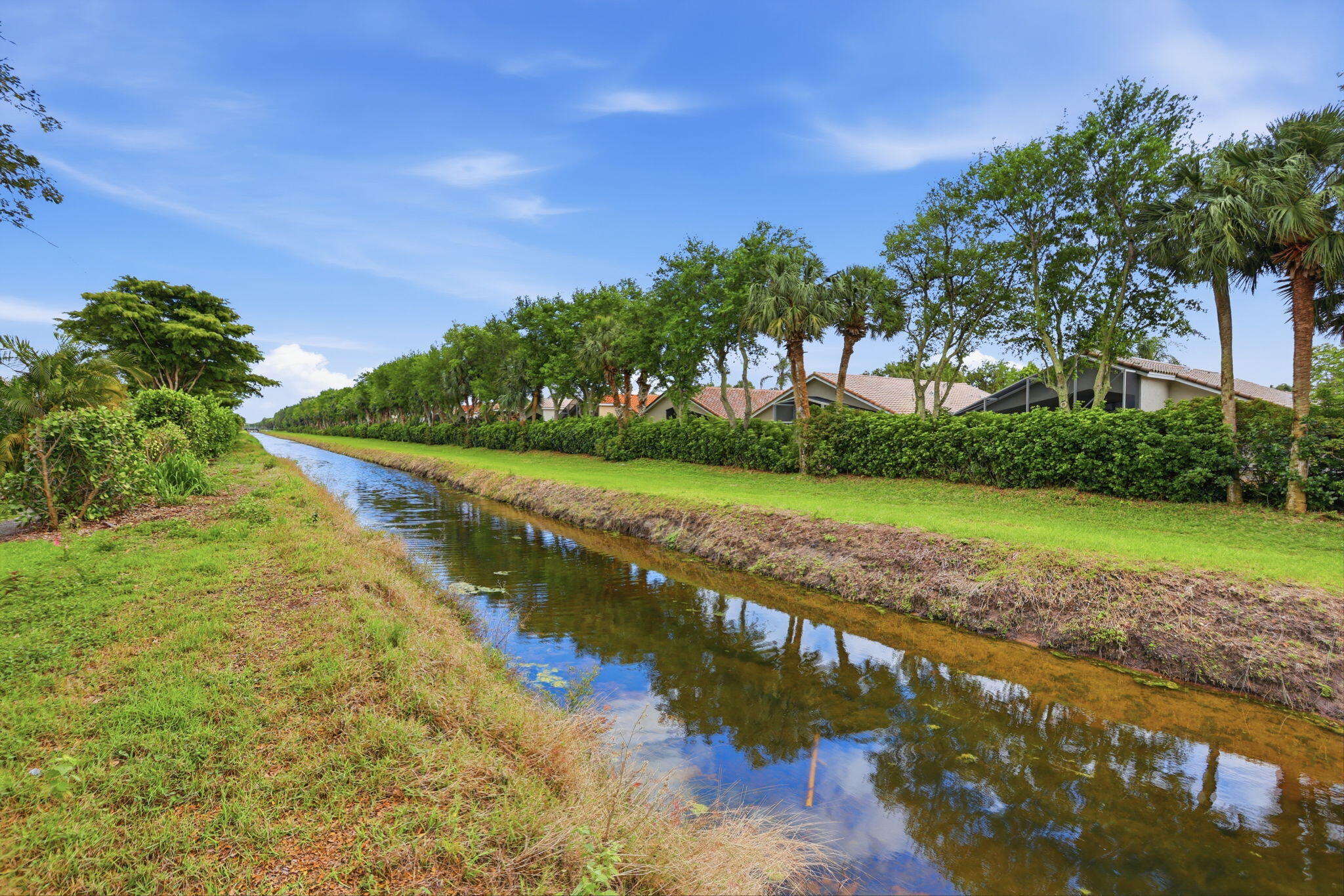 7832 Rockford Road Boynton Beach, FL 33472 - Photo 34 of 40 a view of a lake with a yard