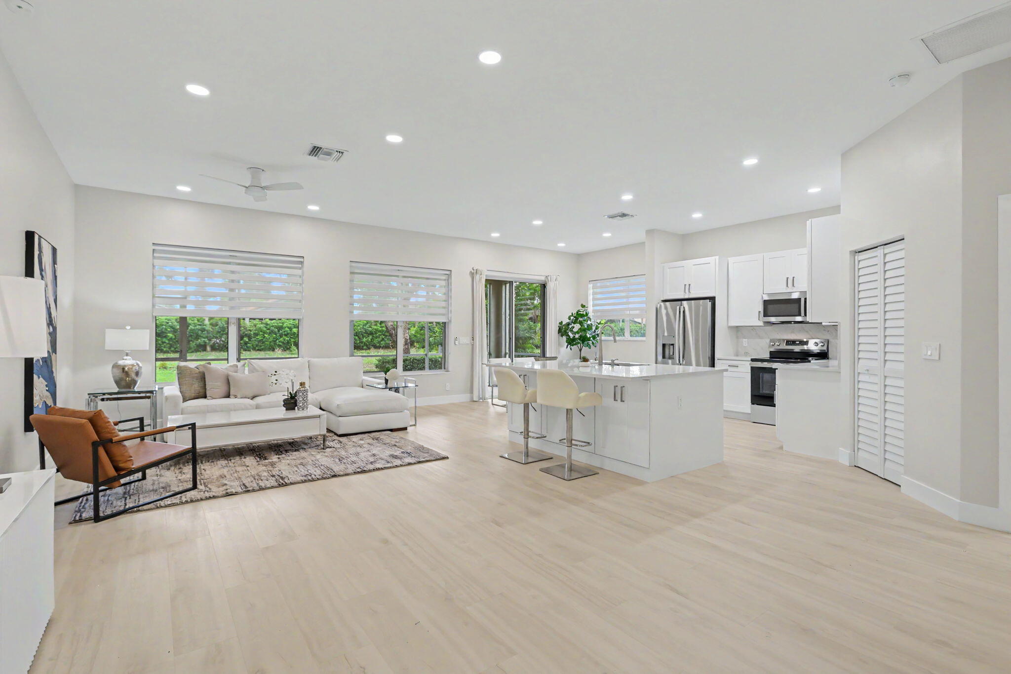 7832 Rockford Road Boynton Beach, FL 33472 - Photo 5 of 40 a living room with furniture and a large window