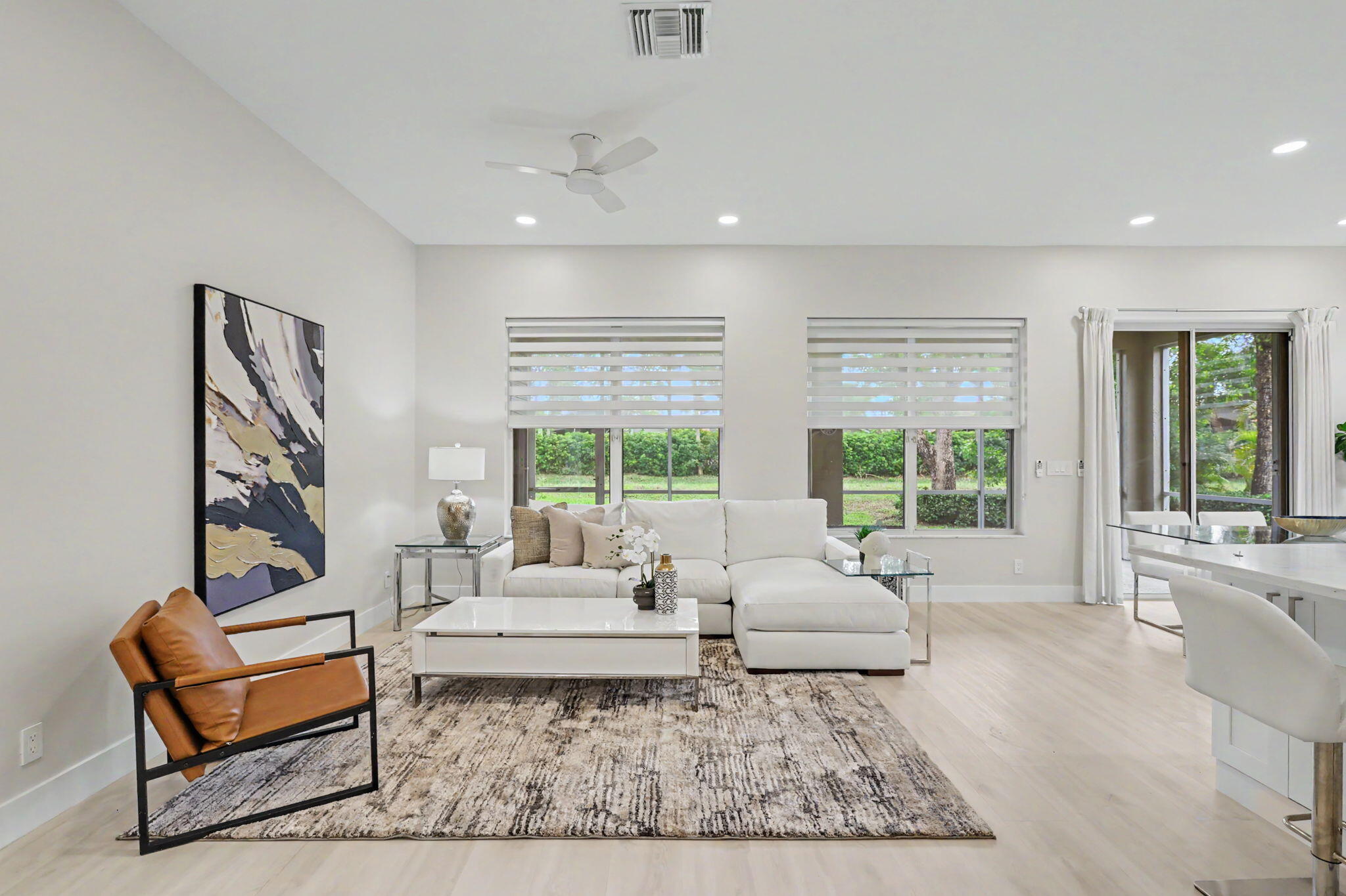 7832 Rockford Road Boynton Beach, FL 33472 - Photo 7 of 40 a living room with furniture and a large window