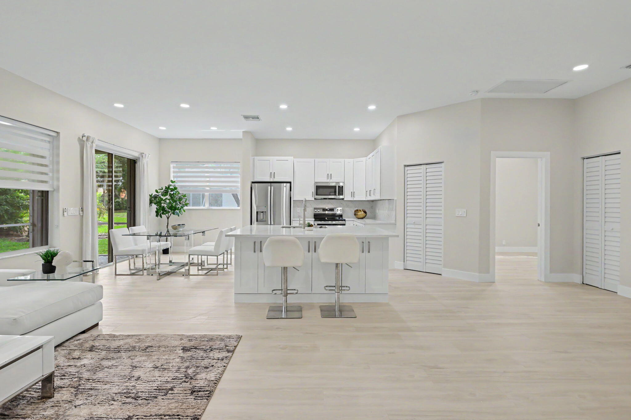 7832 Rockford Road Boynton Beach, FL 33472 - Photo 9 of 40 a living room with furniture and a large window