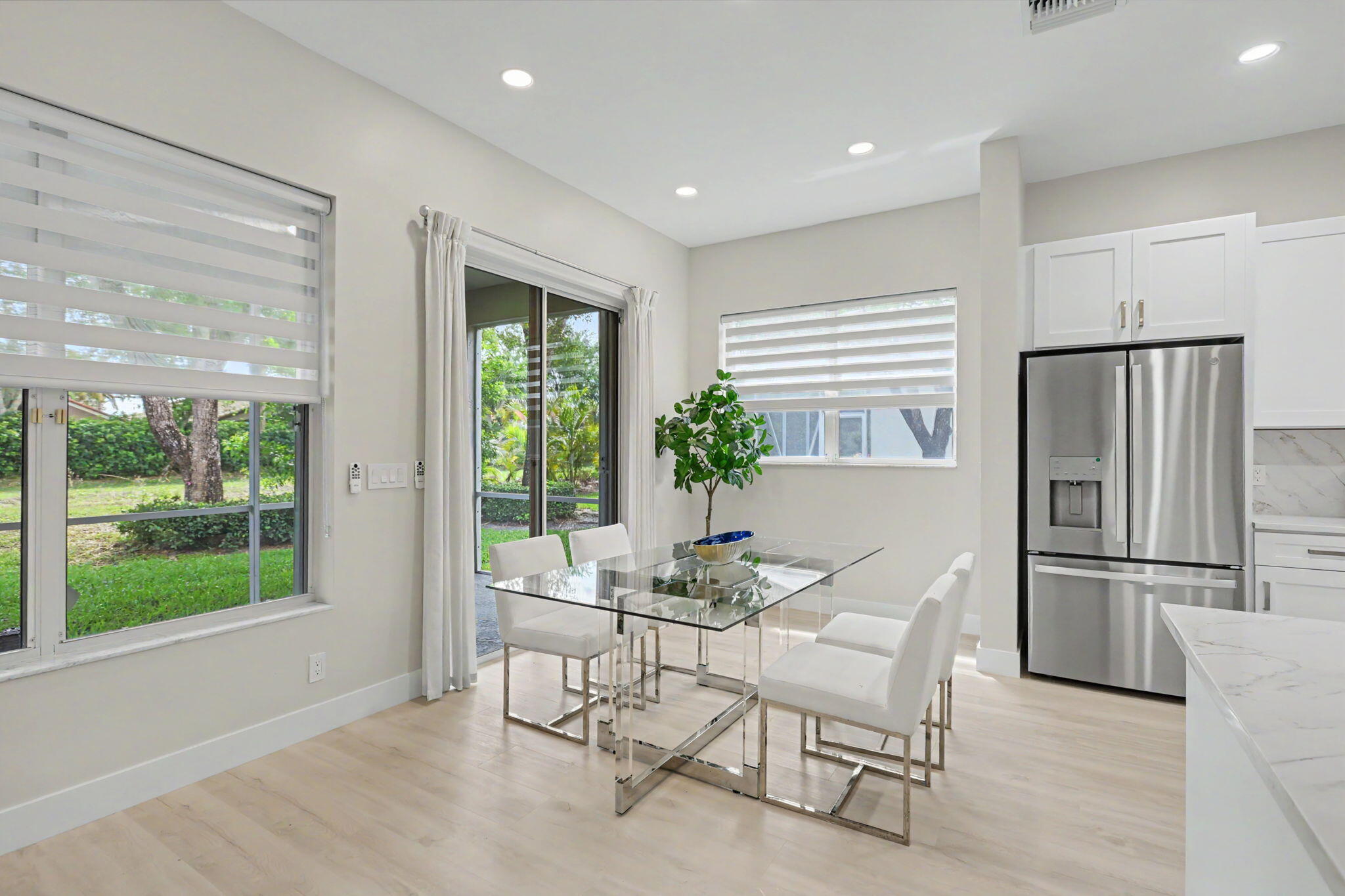 7832 Rockford Road Boynton Beach, FL 33472 - Photo 10 of 40 a dining room with furniture and a window