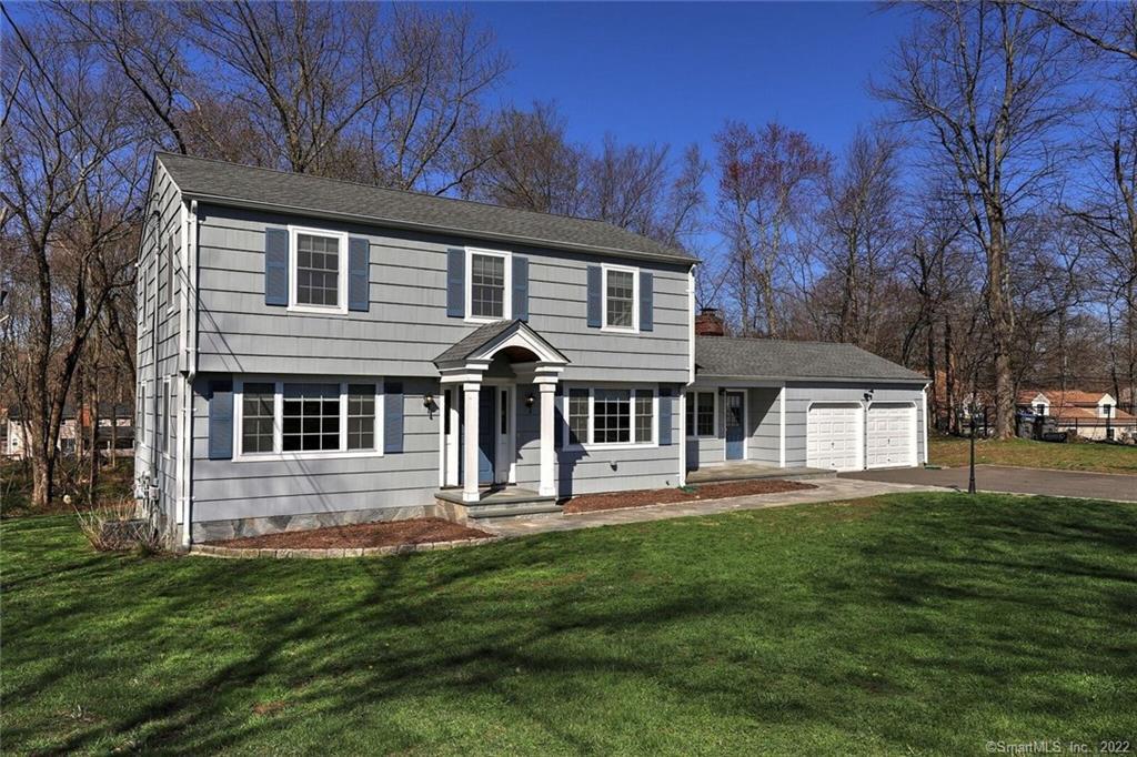 487 Dayton Road Trumbull, CT 06611 - Photo 1 of 1 a front view of a house with a yard