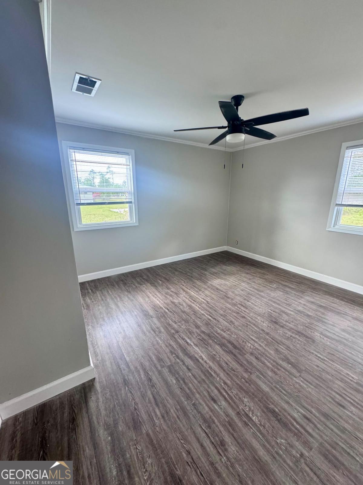 15 Dogwood Road Hazlehurst, GA 31539 - Photo 11 of 16 wooden floor in an empty room with a window
