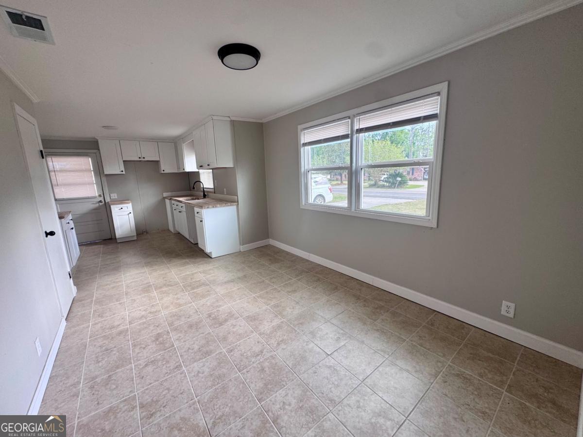 15 Dogwood Road Hazlehurst, GA 31539 - Photo 6 of 16 a view of a kitchen with furniture and window