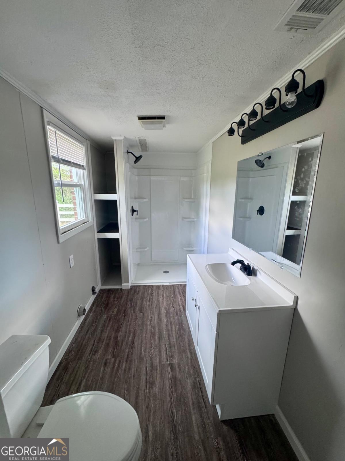 15 Dogwood Road Hazlehurst, GA 31539 - Photo 8 of 16 a kitchen with a sink dishwasher and a refrigerator