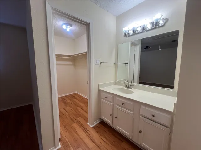 a bathroom with a double vanity sink and mirror