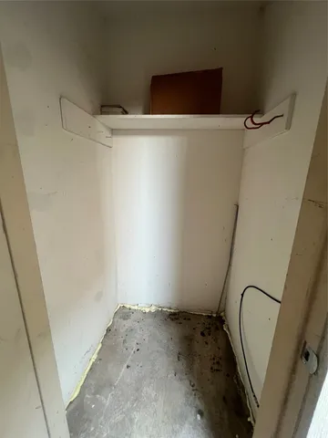 a view of a room with racks on the wall