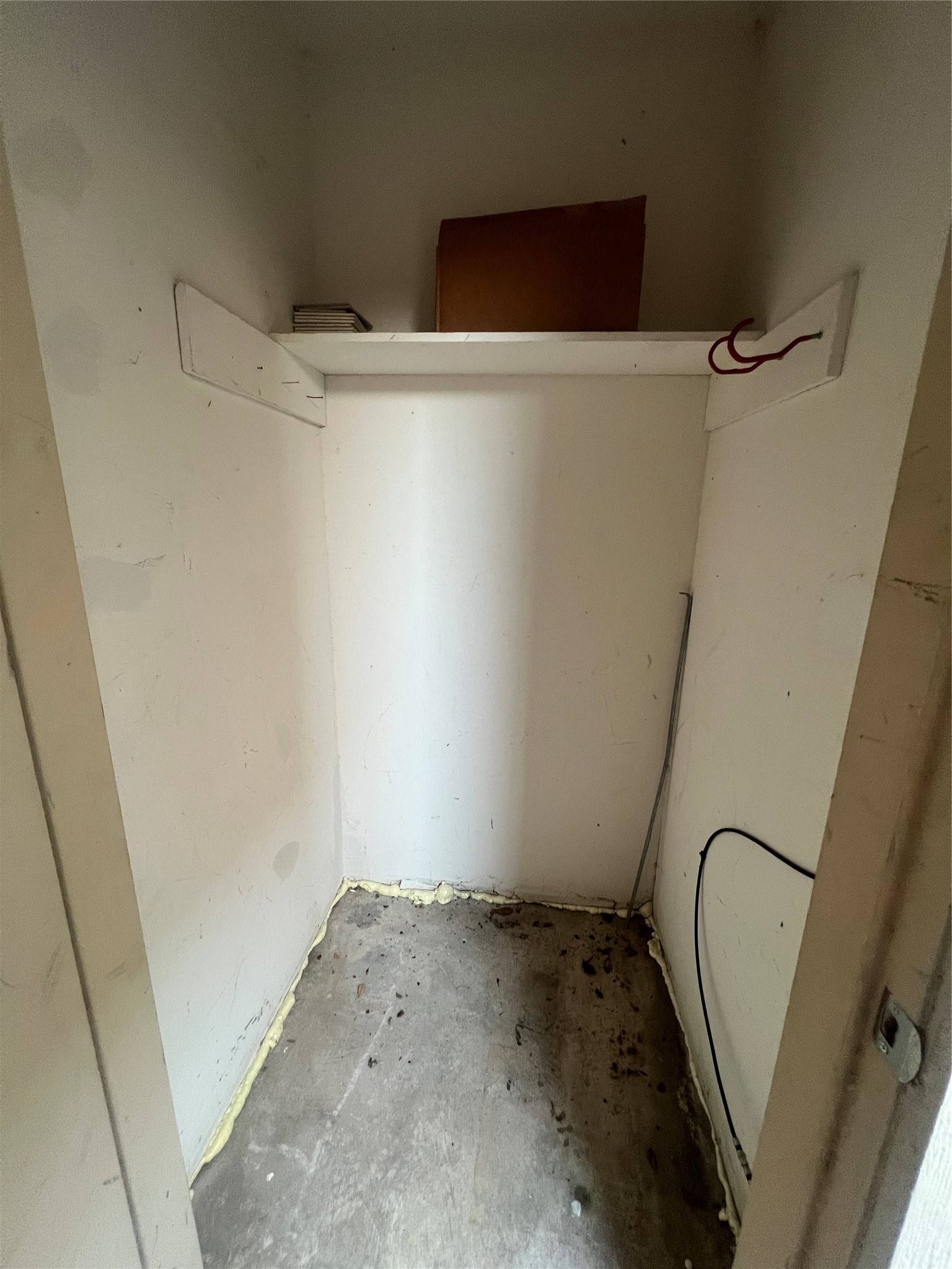 3837 Tanglewilde Street, Unit 3837 Houston, TX 77063 - Photo 10 of 12 a view of a room with racks on the wall