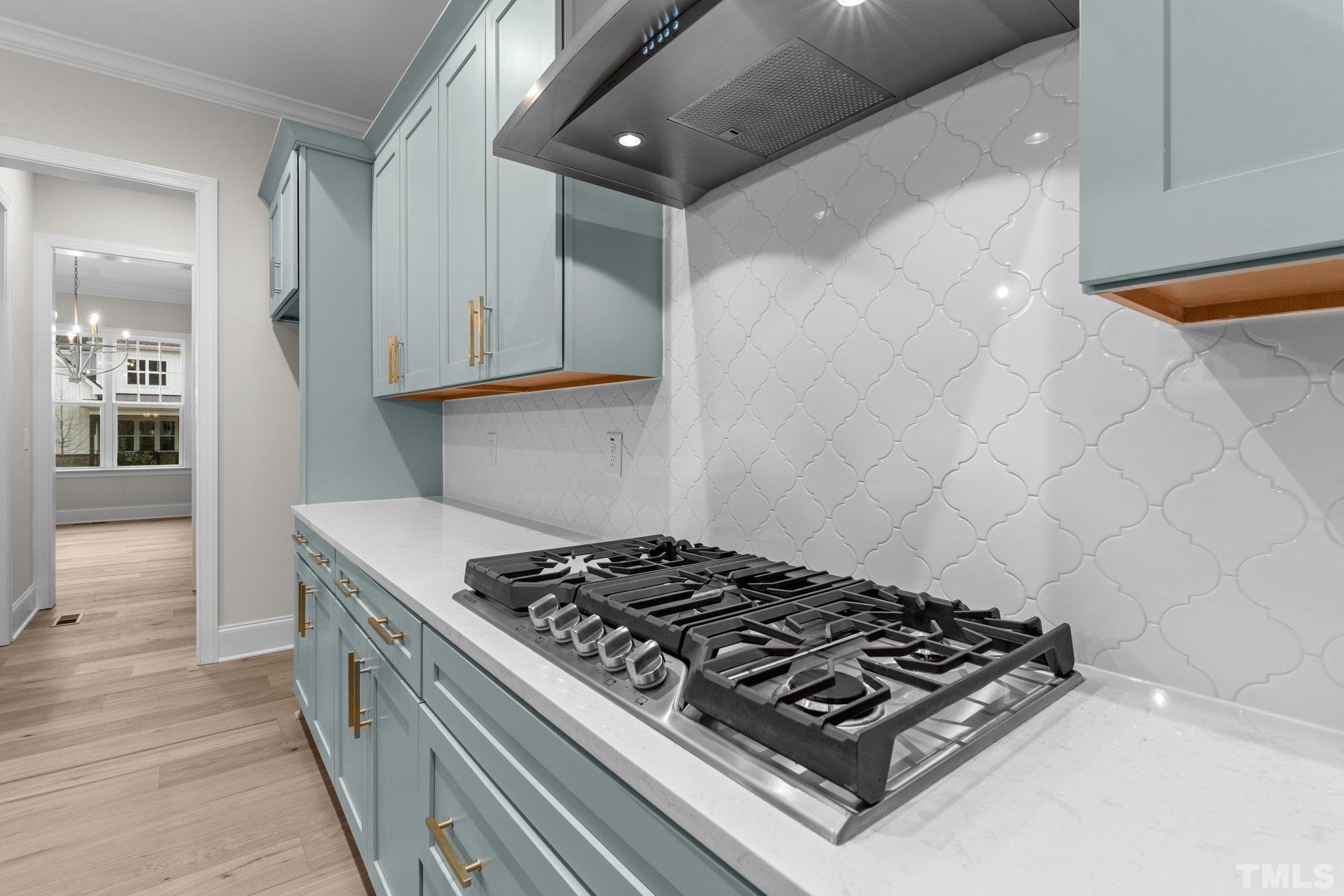 9321 Field Maple Court Raleigh, NC 27613 - Photo 11 of 44 a stove top oven sitting inside of a kitchen