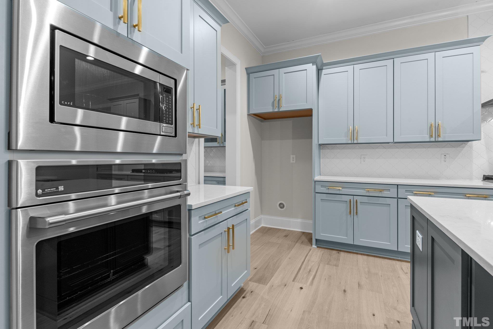 9321 Field Maple Court Raleigh, NC 27613 - Photo 12 of 44 a kitchen with appliances and cabinets