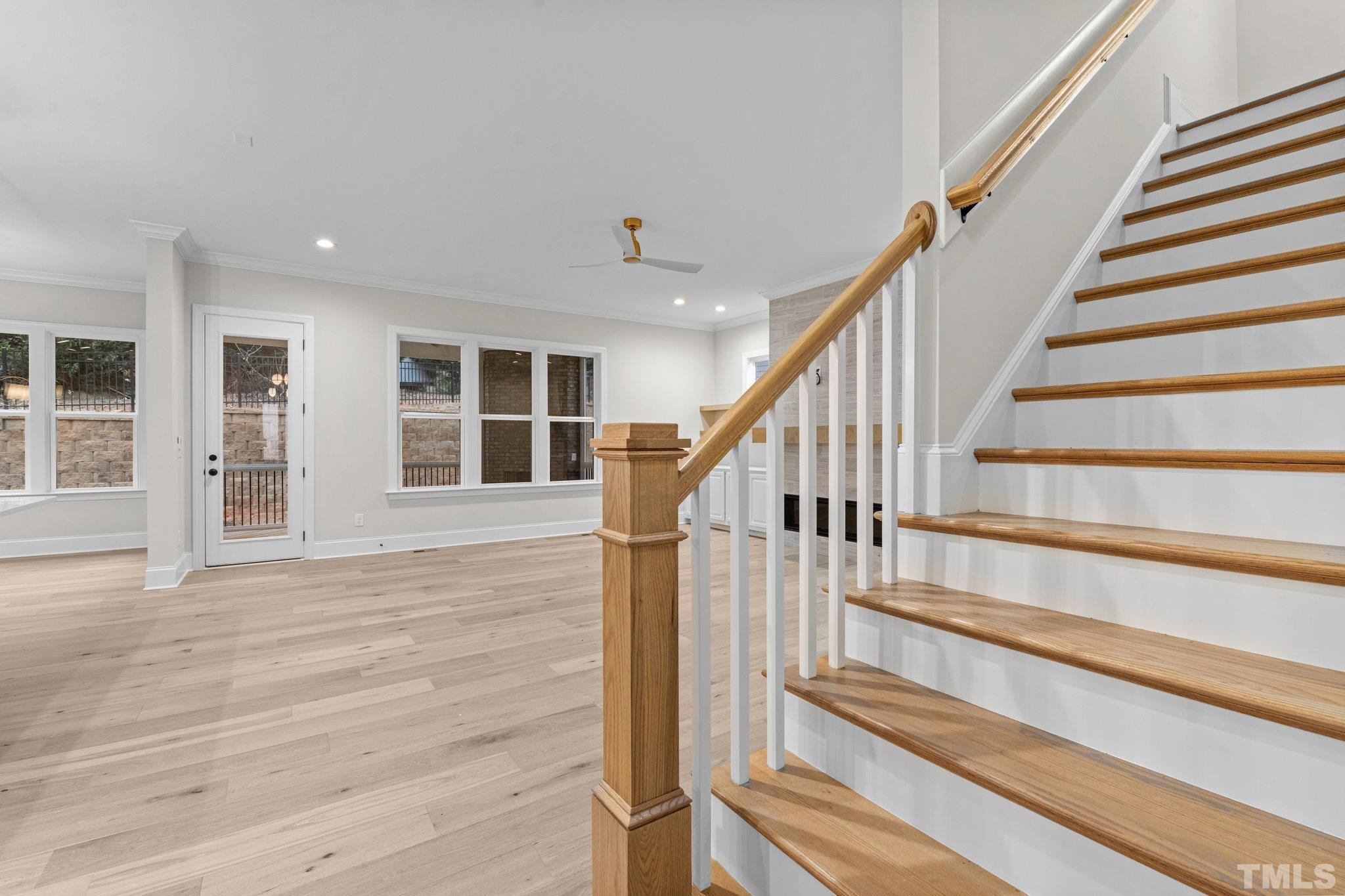 9321 Field Maple Court Raleigh, NC 27613 - Photo 19 of 44 a view of staircase with wooden floor and stairs