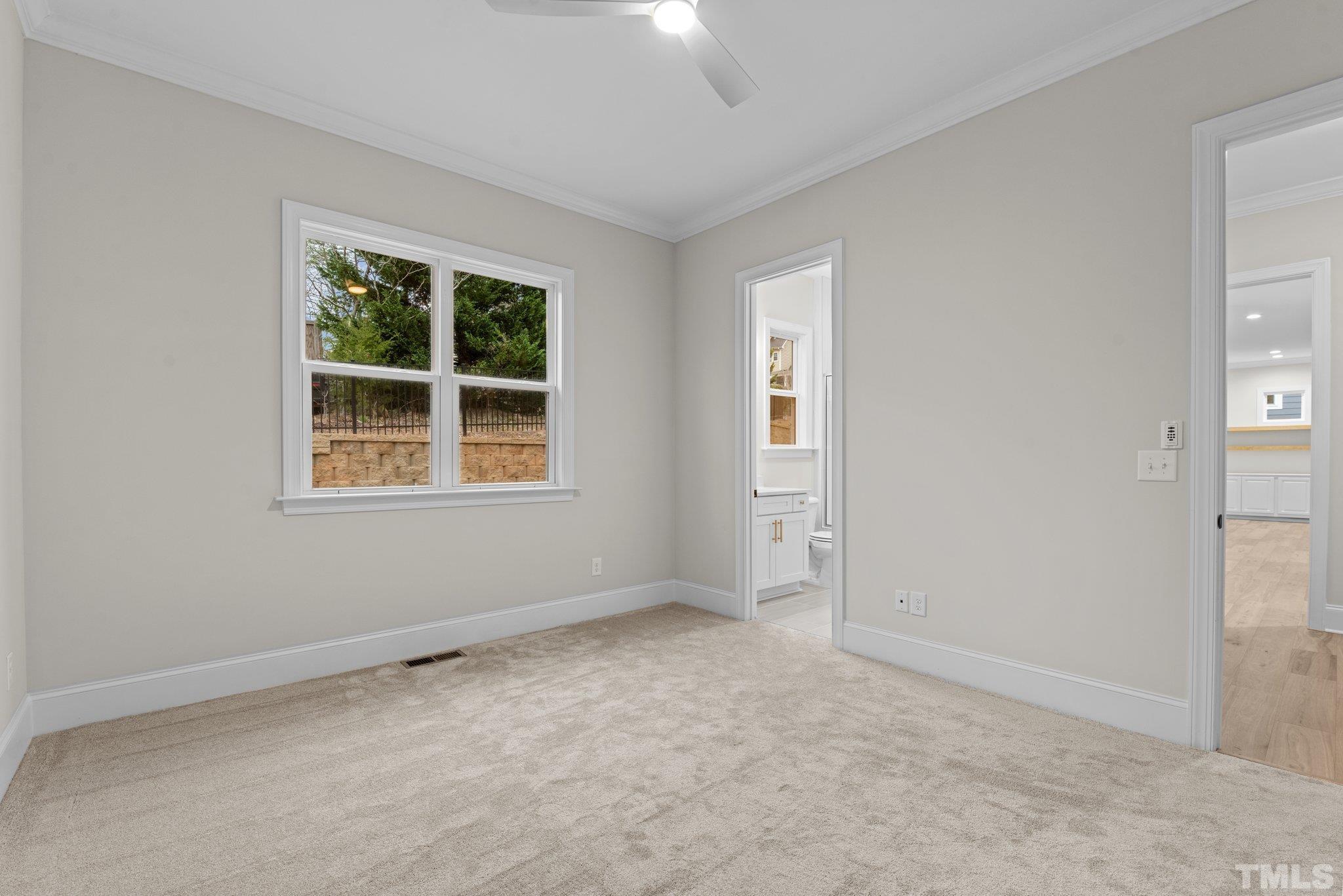9321 Field Maple Court Raleigh, NC 27613 - Photo 22 of 44 an empty room with windows