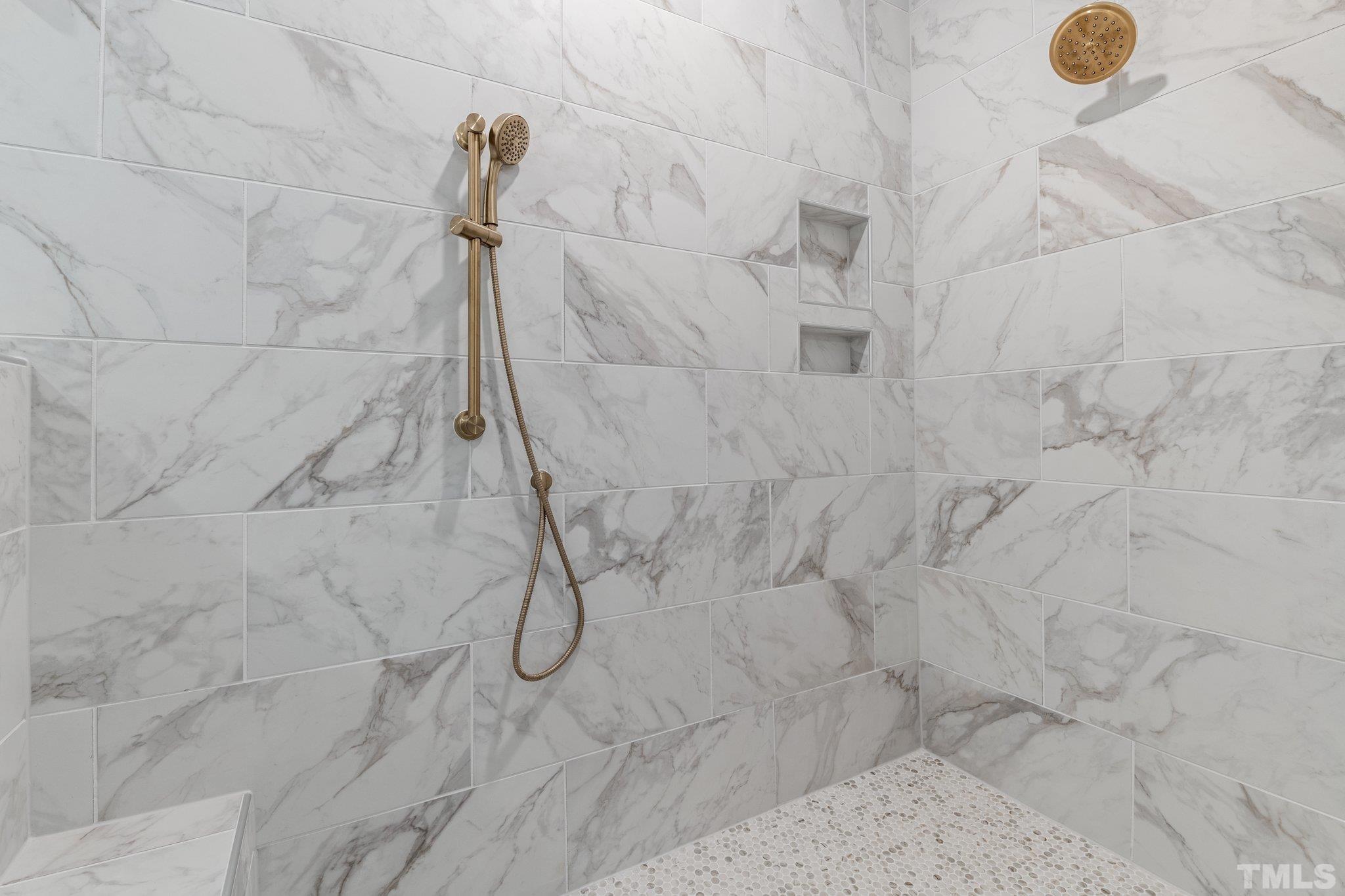 9321 Field Maple Court Raleigh, NC 27613 - Photo 28 of 44 a bathroom with a shower