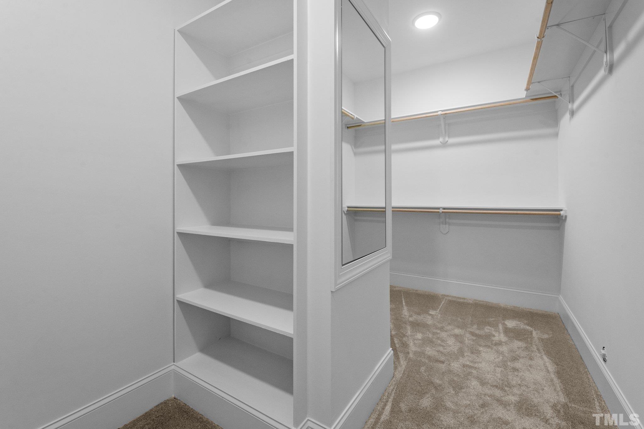 9321 Field Maple Court Raleigh, NC 27613 - Photo 32 of 44 a view of an empty walk in closet