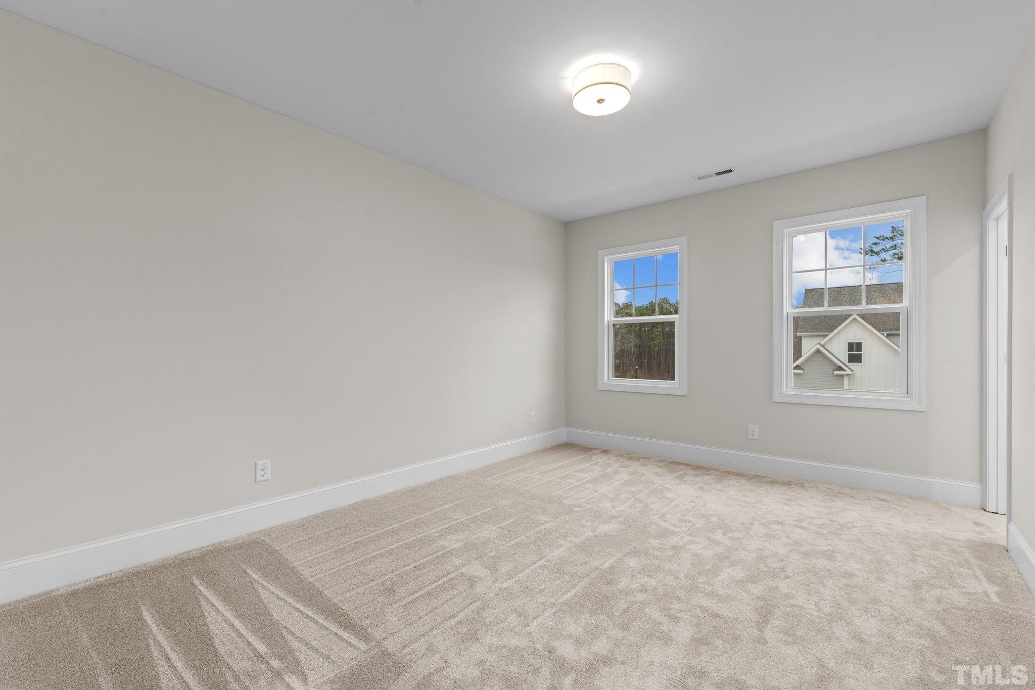 9321 Field Maple Court Raleigh, NC 27613 - Photo 33 of 44 an empty room with windows