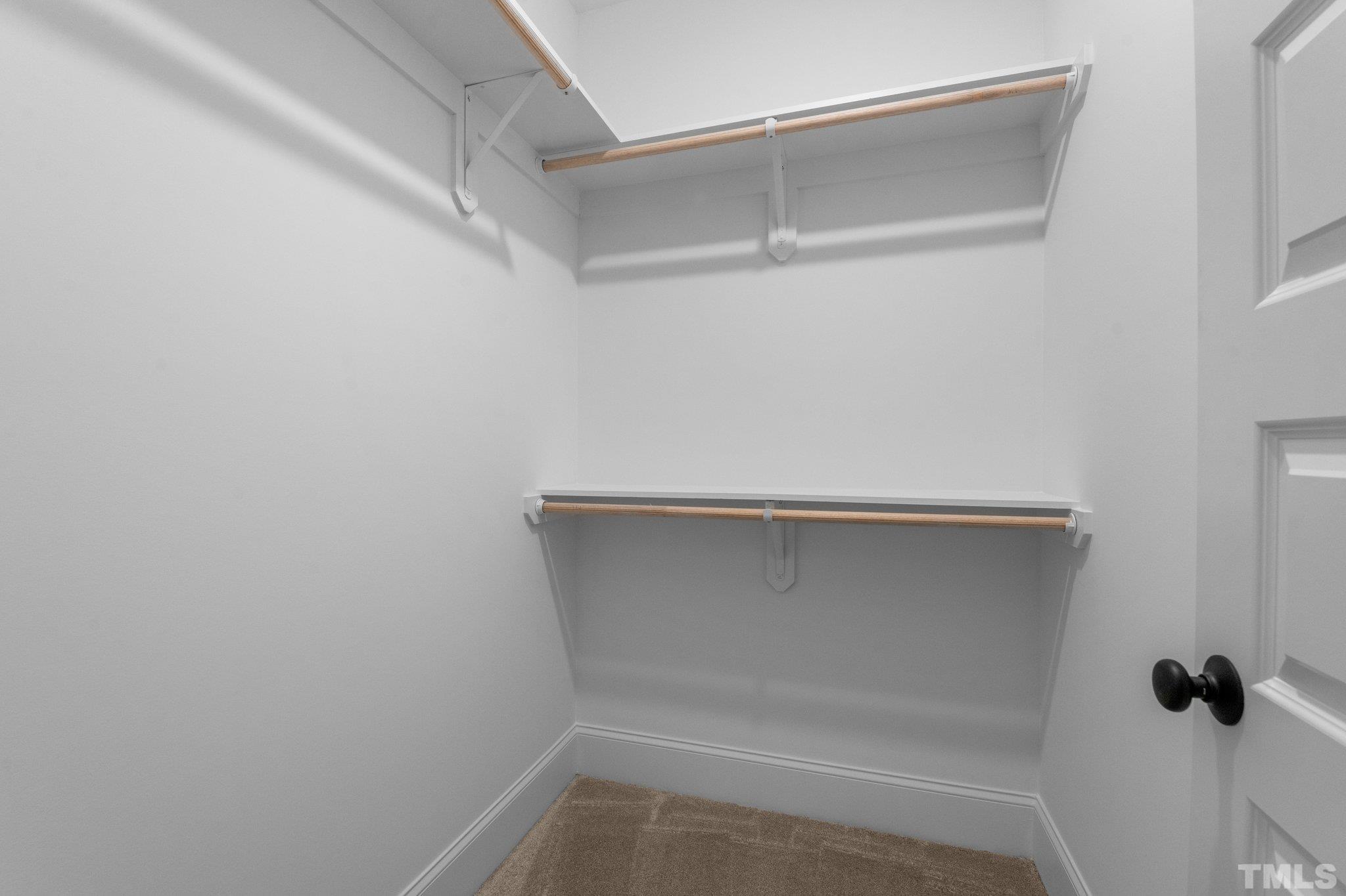 9321 Field Maple Court Raleigh, NC 27613 - Photo 34 of 44 a view of an empty walk in closet