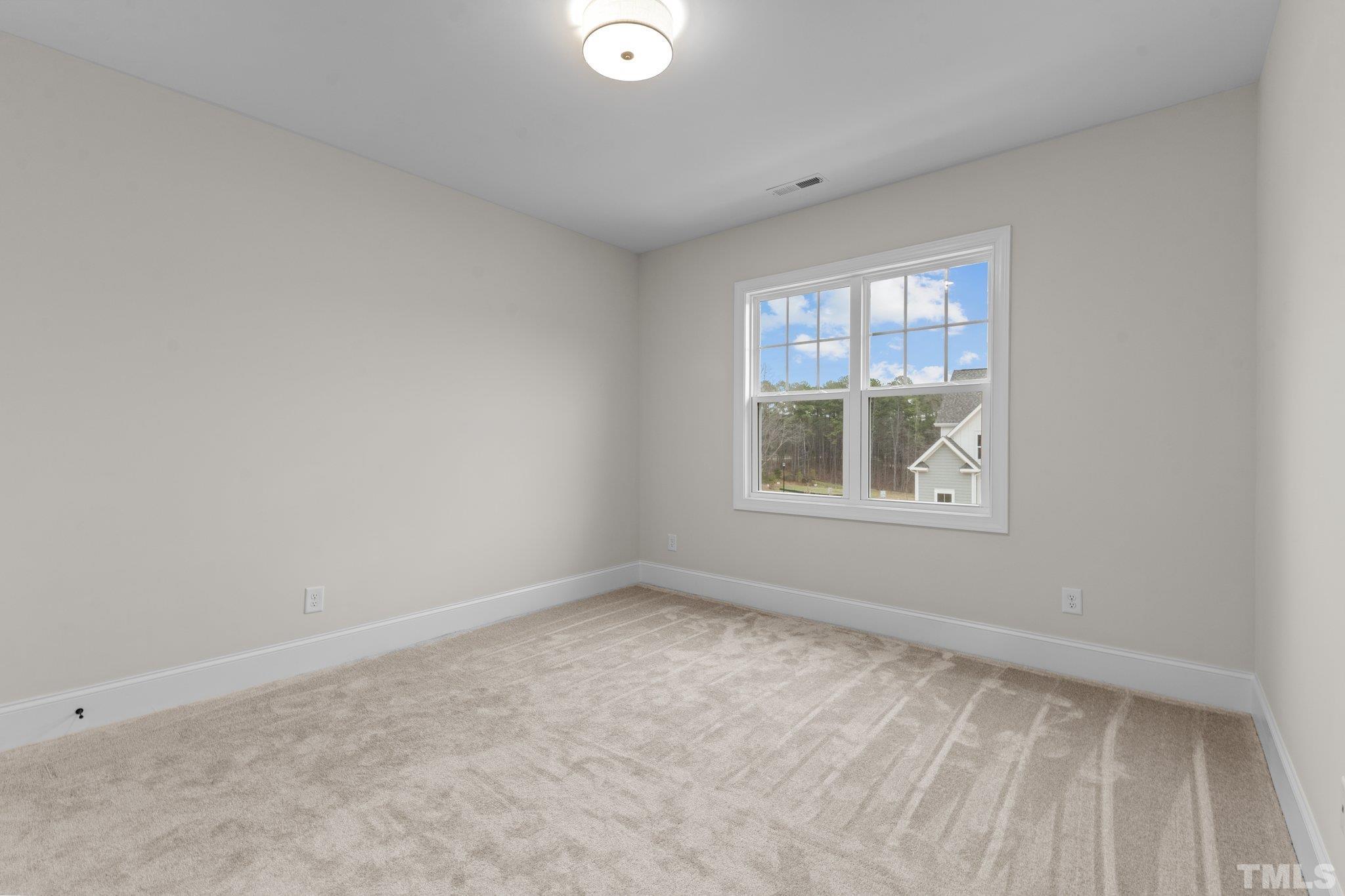 9321 Field Maple Court Raleigh, NC 27613 - Photo 36 of 44 an empty room with a window