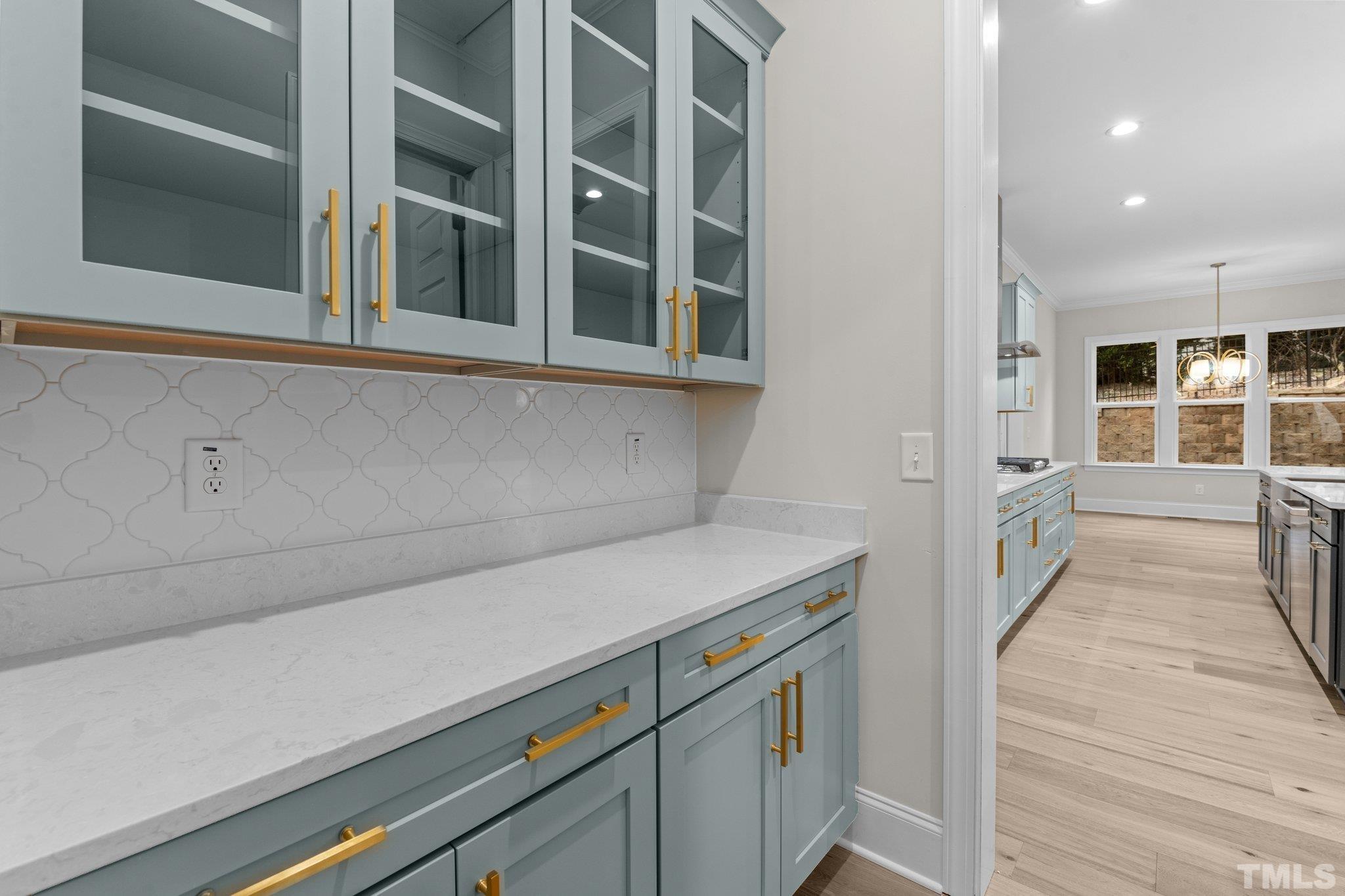 9321 Field Maple Court Raleigh, NC 27613 - Photo 9 of 44 a hallway with cabinets