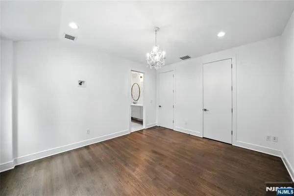 a spacious bathroom with a bathtub and sink
