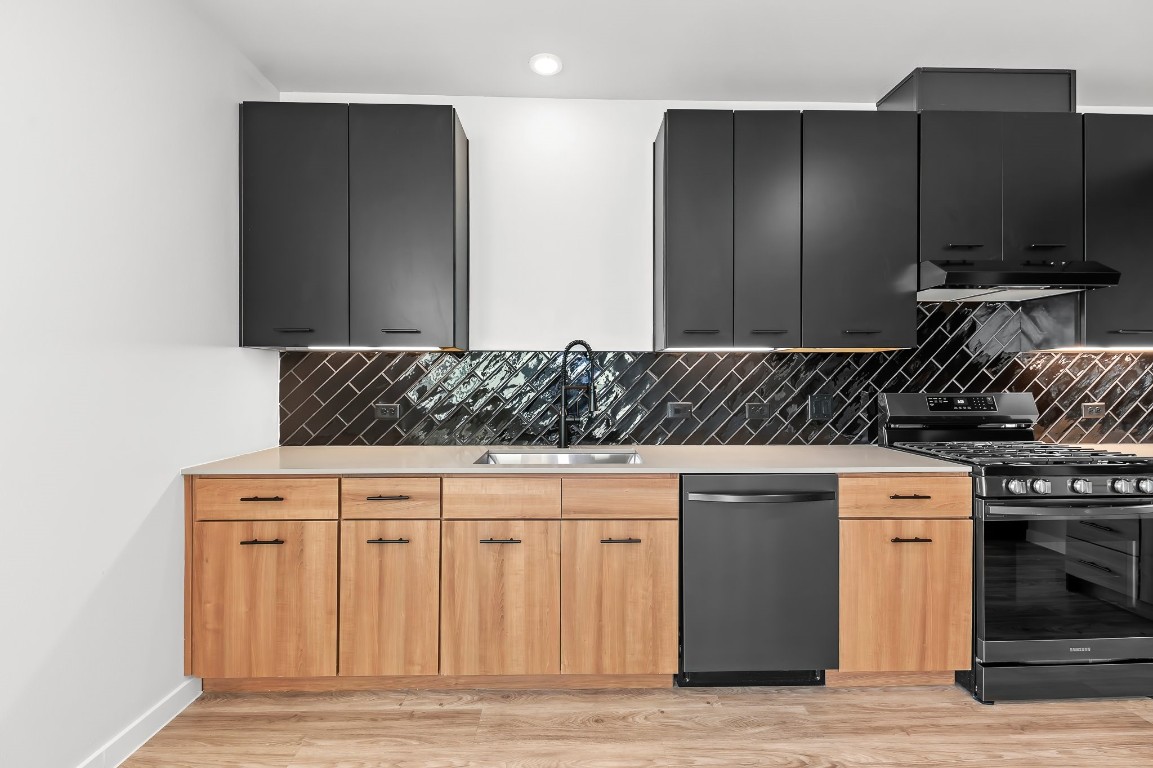 4510 Terry-O Lane, Unit 143 Austin, TX 78745 - Photo 12 of 20 a kitchen with stainless steel appliances granite countertop a stove and a granite counter tops