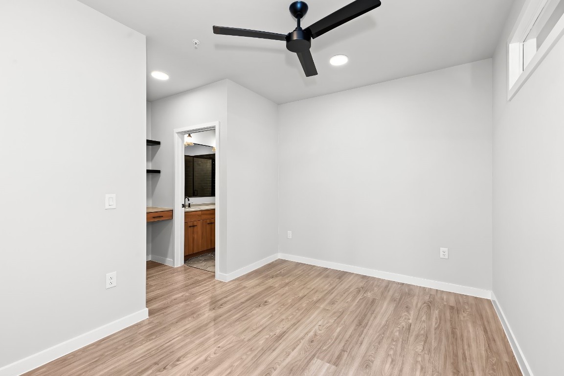 4510 Terry-O Lane, Unit 143 Austin, TX 78745 - Photo 16 of 20 a view of a room with wooden floor and white walls