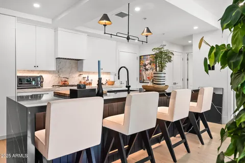 an outdoor patio with table and chairs