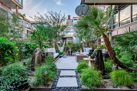 a living room with furniture and a potted plant