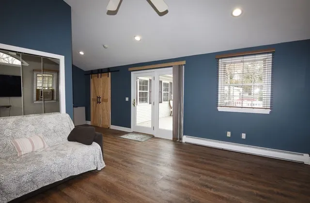 a white bath tub sitting next to a white sink